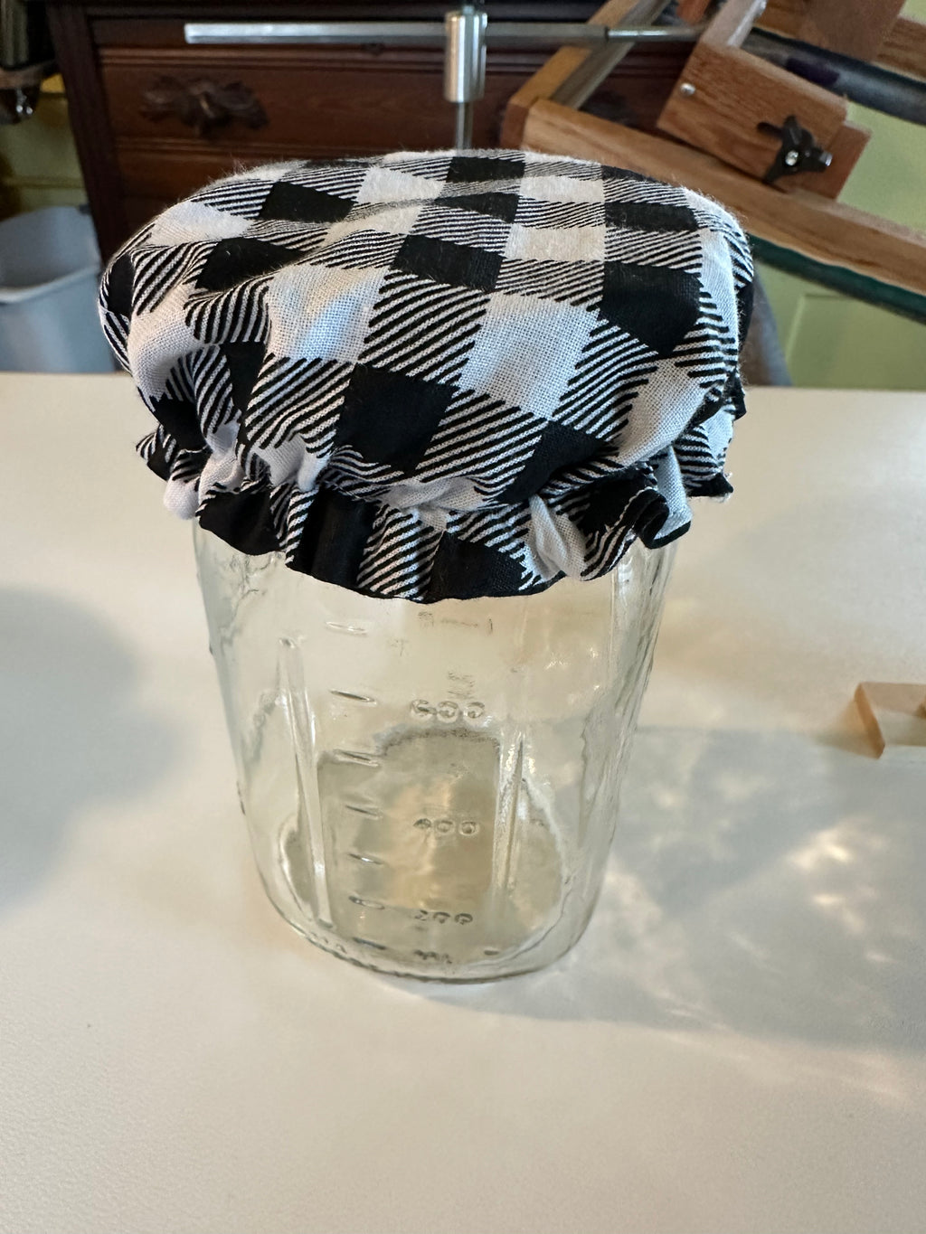 Black and white checked jar cover